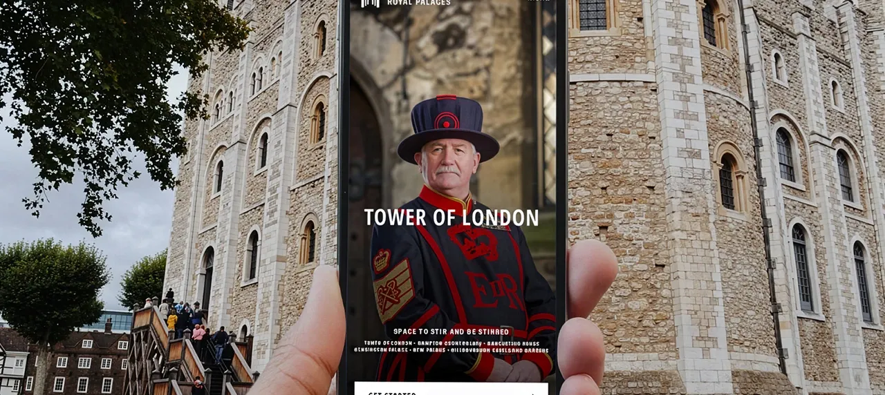 HRP HERO - promotional image of the app being used on mobile phone in front of tower