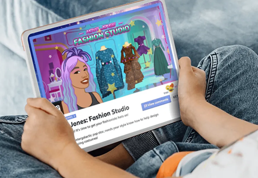 Child on tablet using the BBC Nova Jones Fashion studio game