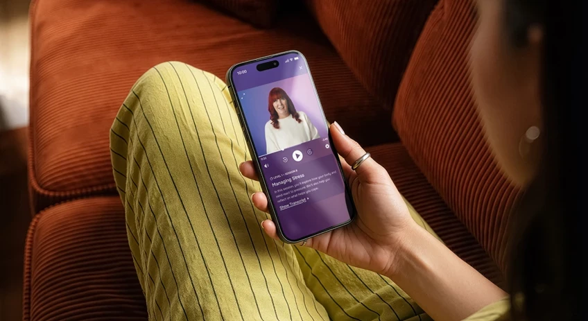 Lumino app being used by lady on a sofa